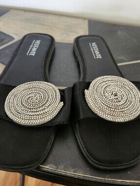 Black Slide Mules with Spiral Crystal Medallion